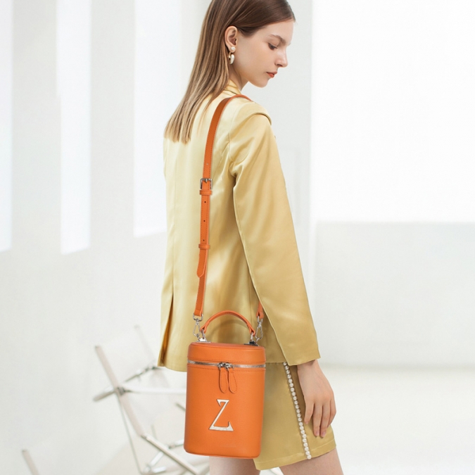 カスタムロゴ付きの女性のための2021オレンジ色の本革バケットバッグ 